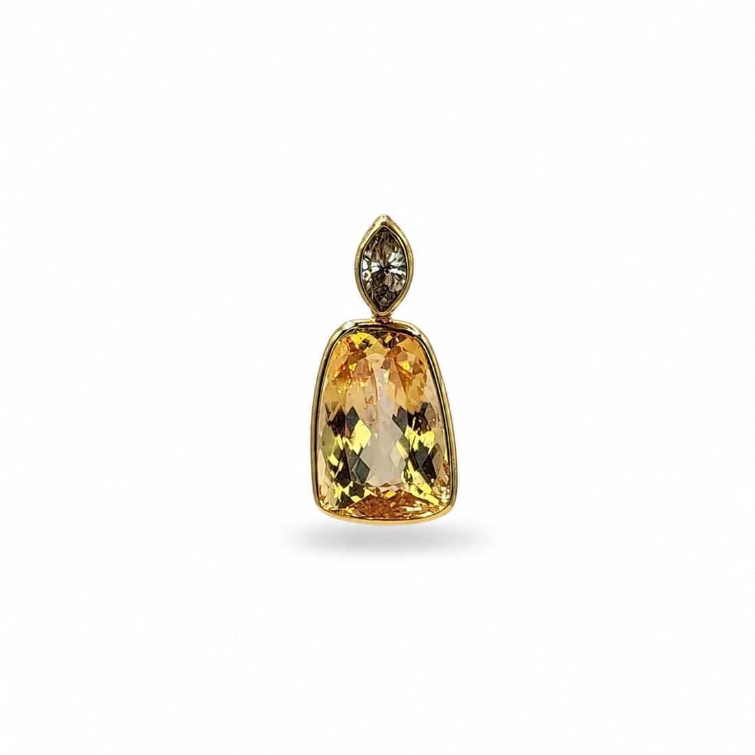 Yellow gold imperial topaz and diamond pendant: A 14kt yellow gold pendant. Imperial topaz Approx. 7cts-10x14mm. 0.30 marquis diamonds J-K color SI quality. 0.9x0.45 inch. 2.74 grams.