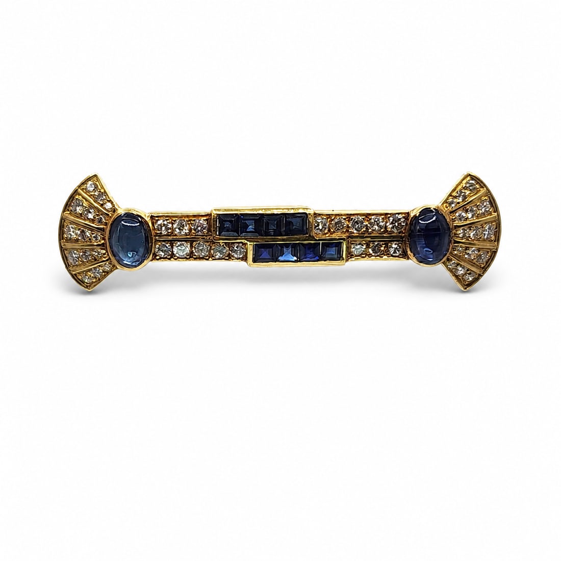 Yellow gold sapphire and diamond Brooch: A 18kt yellow gold Brooch. 1.5-2ct diamonds H-I color. VS quality. 4ct sapphire. 2 cabochon and 8 square. 2.25x0.55 inches 7.8 grams