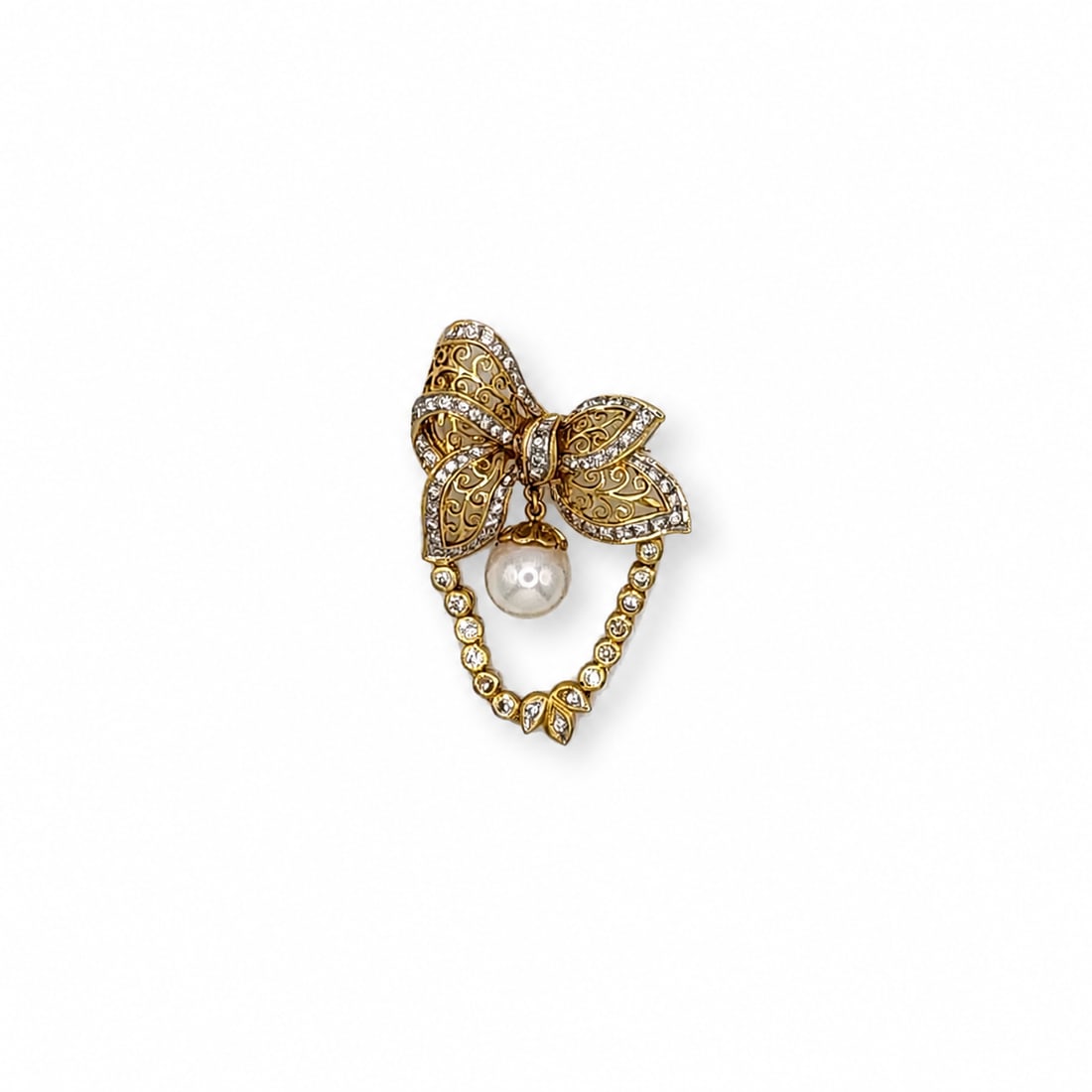 Yellow gold diamond and pearl Brooch: A 18kt yellow gold Brooch. Diamonds 1 ct H-I Color VS-SI Clarity Pearl 8.5 mm. 1.65x 1.05 inches. 8.43 Grams
