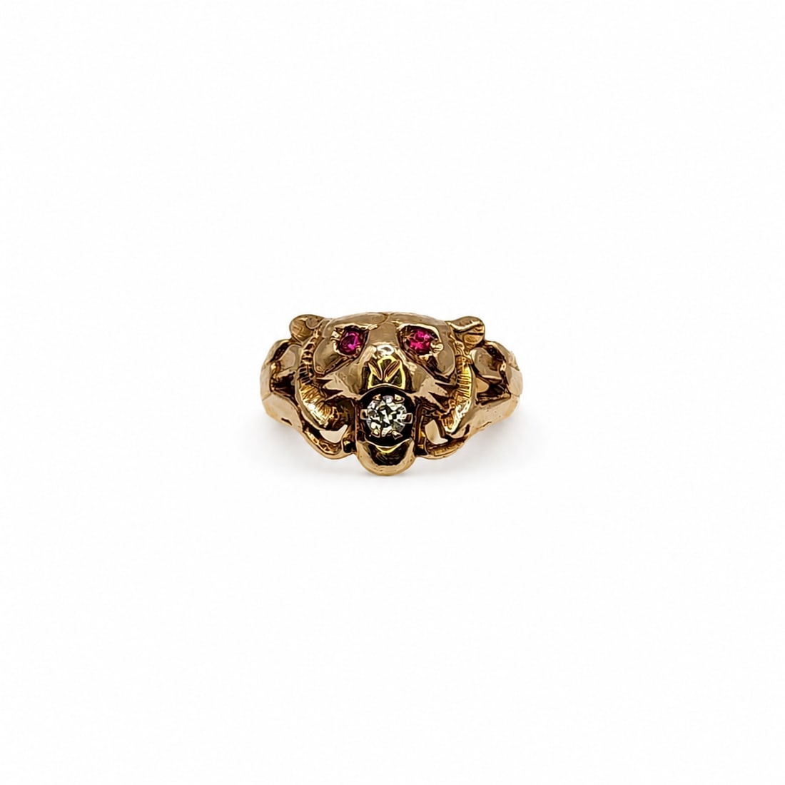 Yellow gold diamond ruby animal ring: A 14kt yellow gold ring. Diamond .15ct. Ruby eyes. Size 8 3/4. 7.6 grams