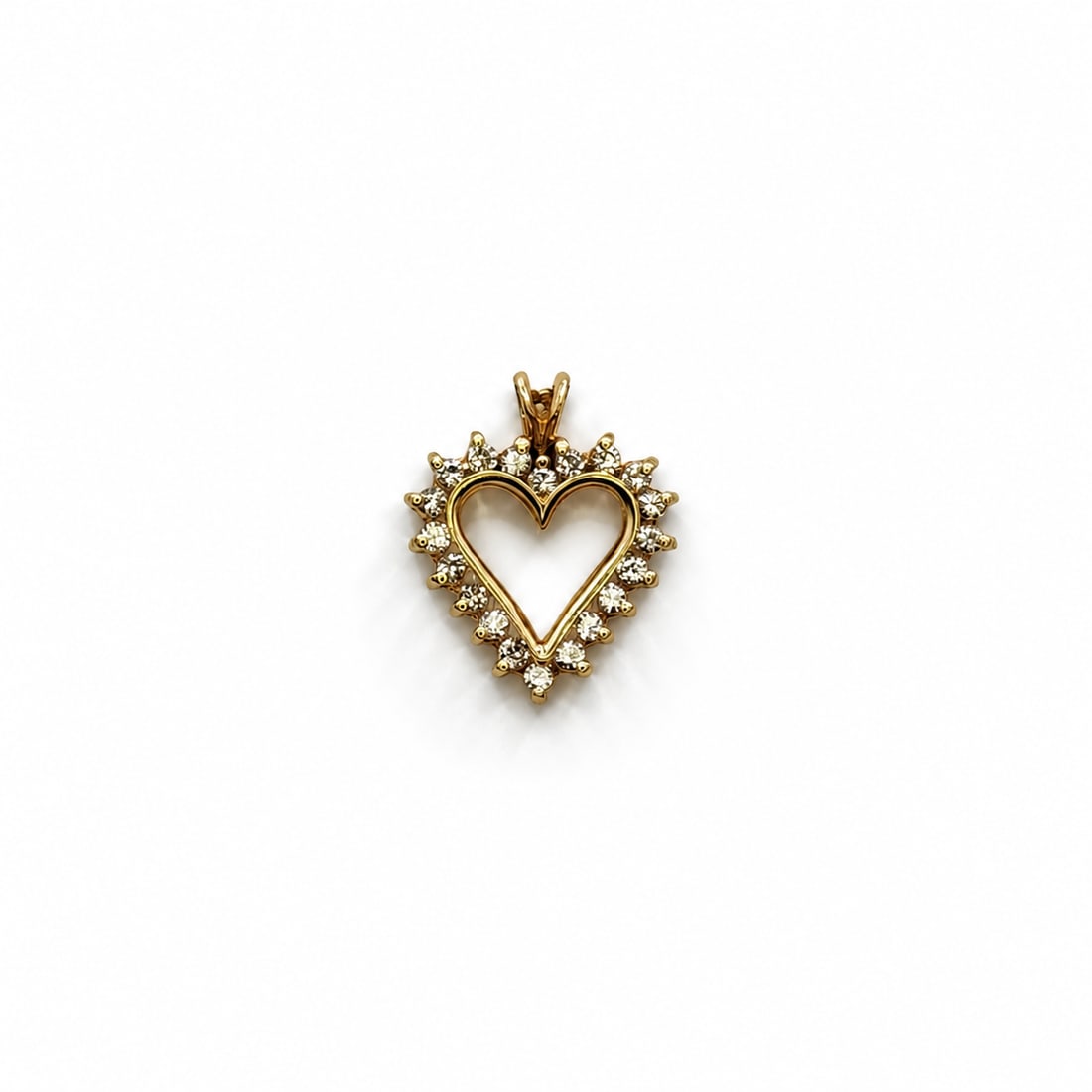Yellow gold diamond heart pendant: A 14kt yellow gold heart pendant. Diamonds .50cts. .79x.64 inches. 2.2 grams