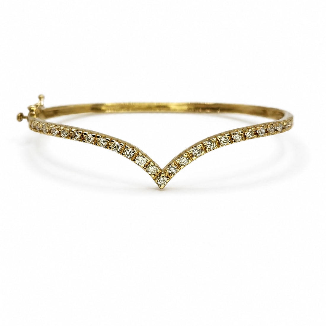 Yellow gold diamond bangle bracelet: A 14kt yellow gold bangle bracelet. Diamonds 1ct I-J color VS SI clarity. Size 6.5 inches 10.19 grams