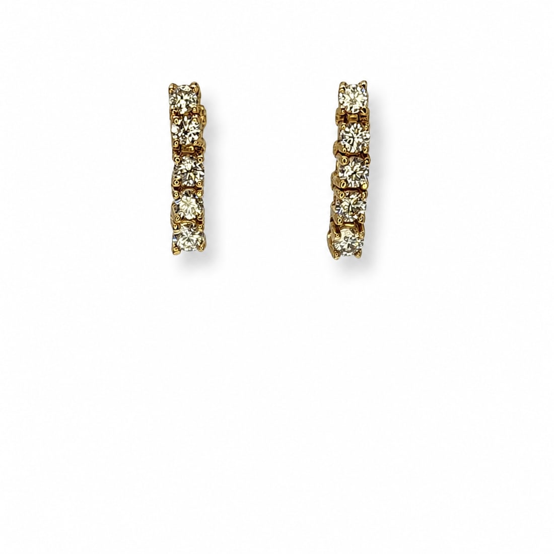 Yellow gold diamond earrings: A 14kt yellow gold earrings. Diamonds 1ct tw H-I color VS clairty. .60 x .13 inches 2.3 grams.
