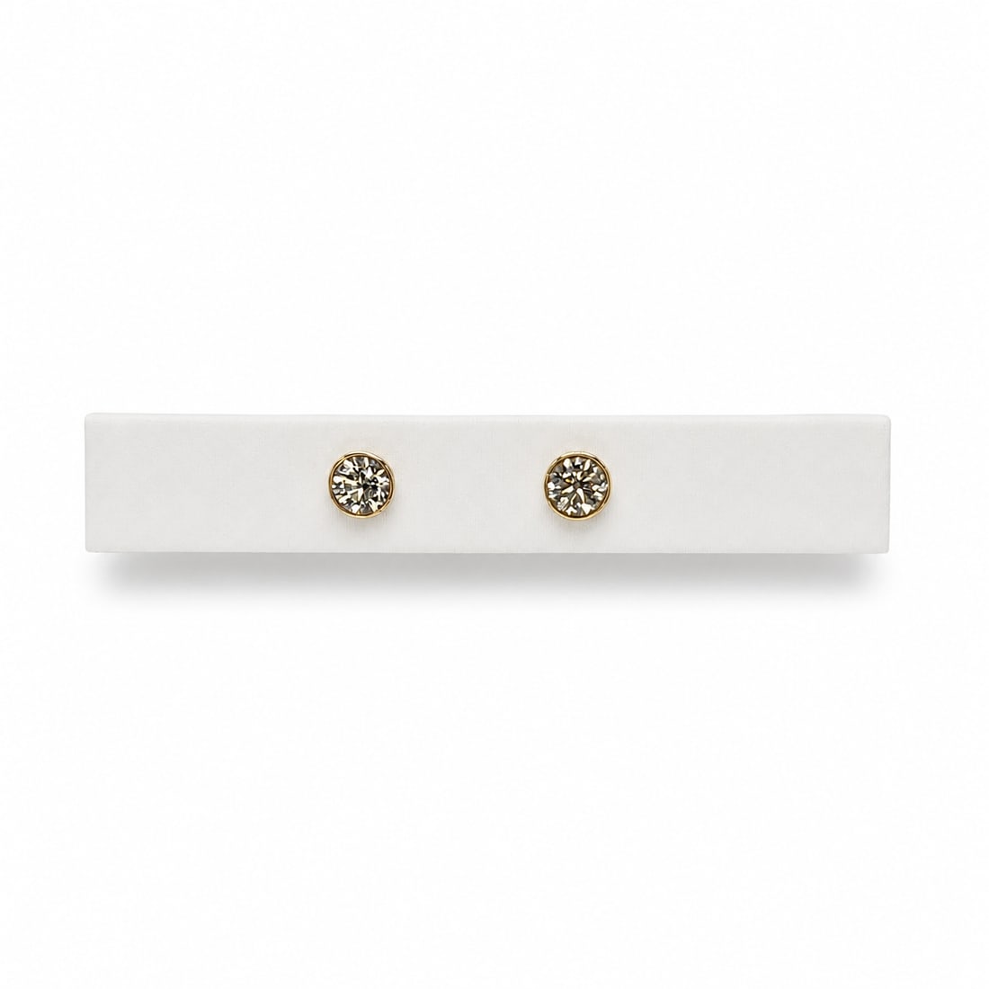 Yellow gold diamond stud earrings: A 14kt Yellow gold bezel diamond stud earrings. Diamonds .75 cts tw H-I color VS-SI clarity. 0.90 grams