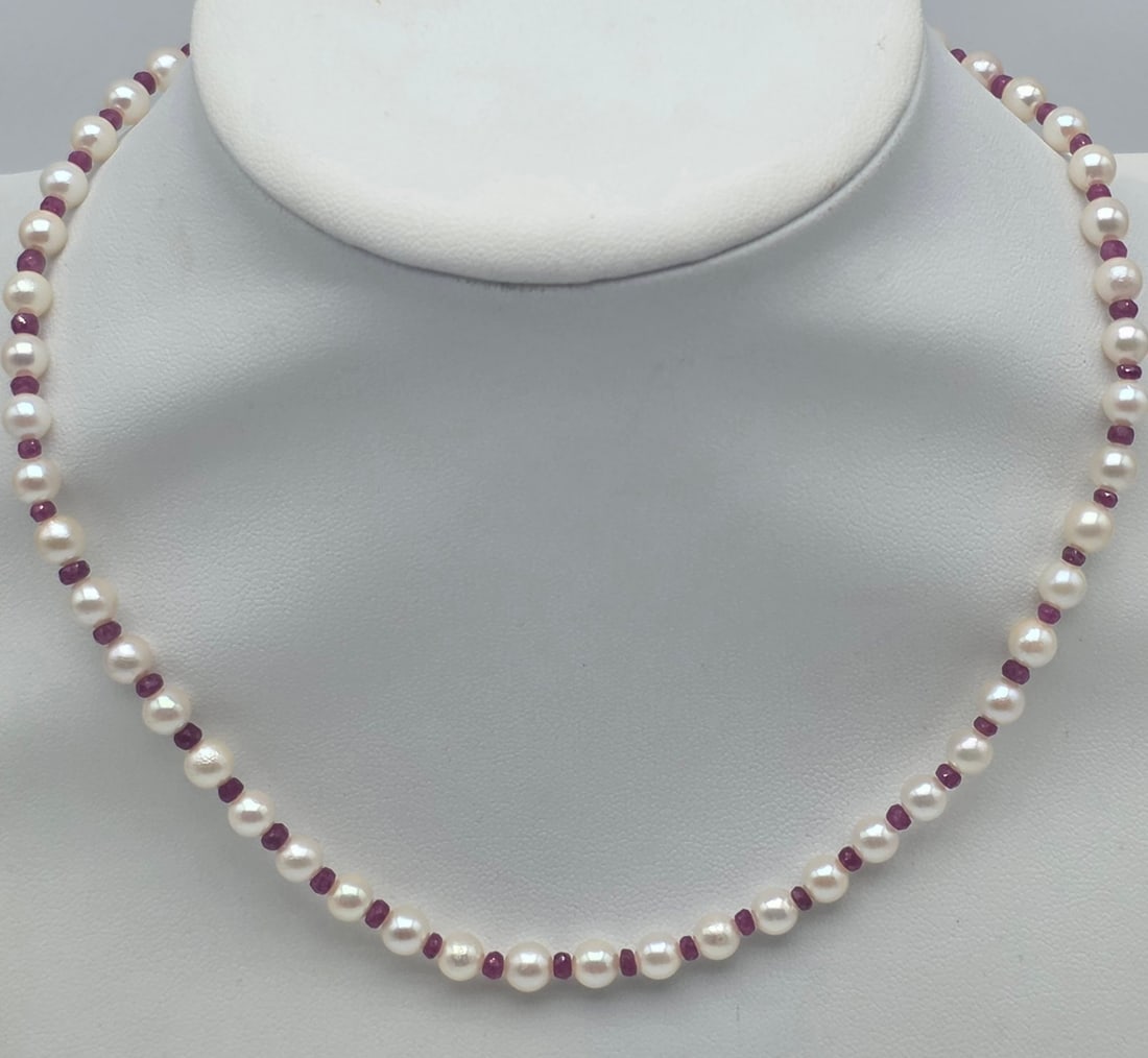 Japanese Akoya Cultured Pearl 42 cm Necklace with Natural Faceted Rubies and 18K Yellow Gold Clasp: Metal: 18K Yellow Gold (750) Clasp / Total Item Weight: 15.00 Grams / Gemstones: Natural Faceted Rubies (Approx. 12 Carats) / Pearl Type: Cultured Akoya Pearls / Origin: Japan / Pearl Diameter: 5.4 ��