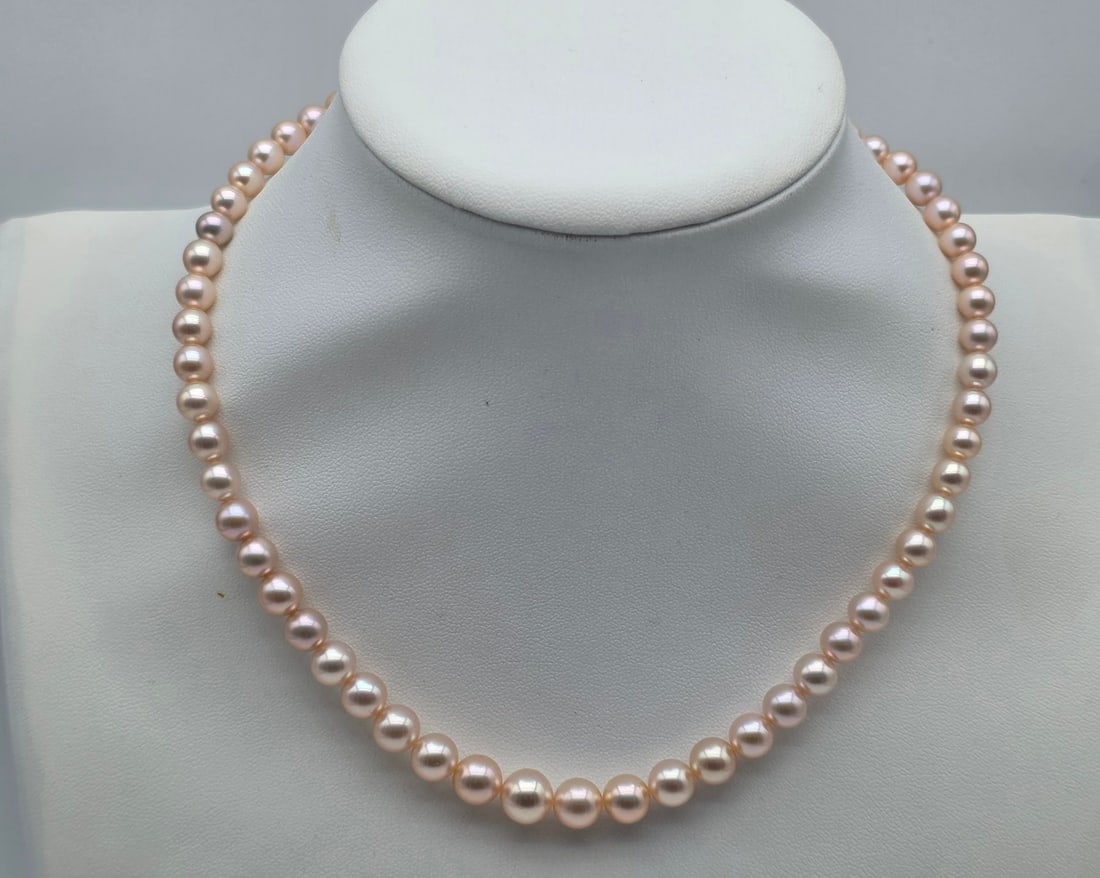 Freshwater Cultured Pearl 42.5 cm Graduated Necklace in Pink-Peach Hues with 18K Yellow Gold Clasp: Metal: 18K Yellow Gold (750) Clasp / Total Item Weight: 26.00 Grams / Pearl Type: Natural Freshwater Cultured Pearls / Pearl Shape: Round / Pearl Size: Graduated from 6.2 to 9.5 mm / Color: Pink/Peach