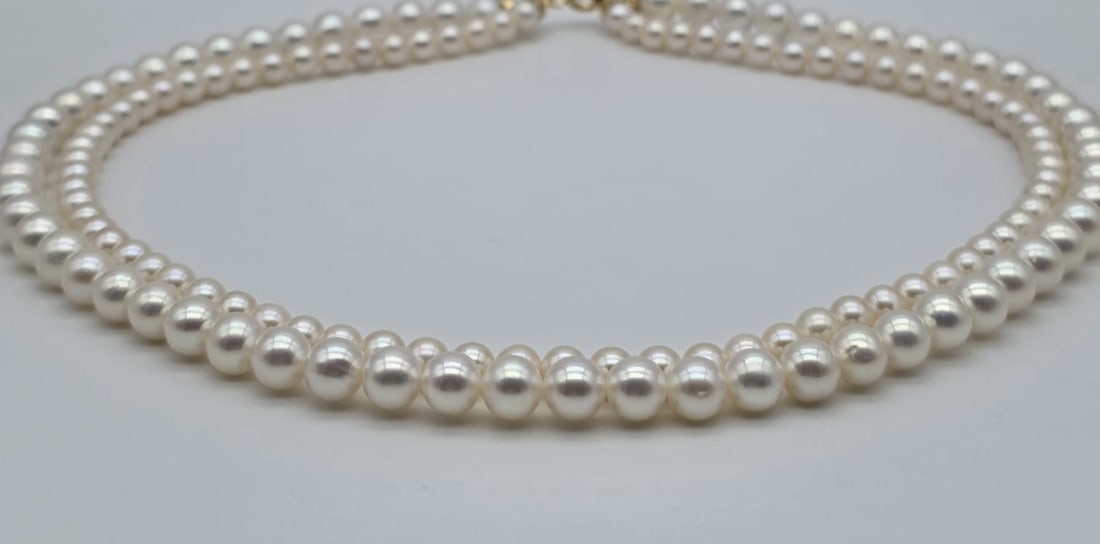 Double-Strand Freshwater Cultured Pearl Necklace with Gold-Plated 925 Sterling Silver Clasp: Metal: Gold-Plated 925 Sterling Silver Clasp / Total Item Weight: 50.00 Grams / Pearl Type: Freshwater Cultured Pearls / Pearl Color: White / Strand 1: Size 7.0 – 7.5 mm, Length 46 cm / Strand 2: Si