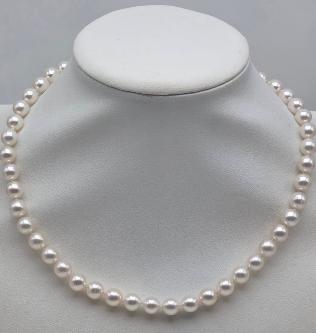 Japanese Akoya Pearl 8-8.5 mm 18K White Gold Clasp Necklace: Japanese Akoya cultured pearl necklace with 18K white gold clasp / Origin: Japan / Pearl Type: Saltwater Akoya cultured pearls / Diameter: 8.0 to 8.5 mm / Color: White with silver and rose overtones /