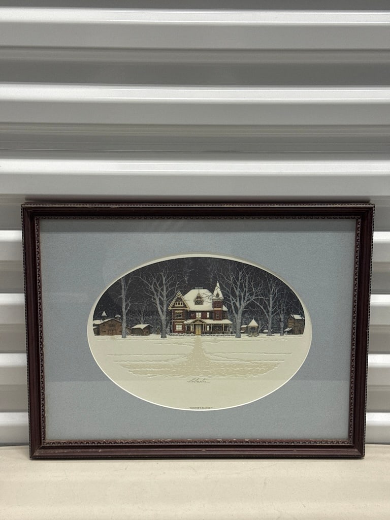 Stephen Sebastian Signed Embossed Lithograph, "Winter's Blanket": An embossed lithograph print on paper titled "Winter's Blanket" by artist Stephen Sebastian. The piece beautifully depicts a serene, snow-covered Victorian house set against a dark winter night sky su