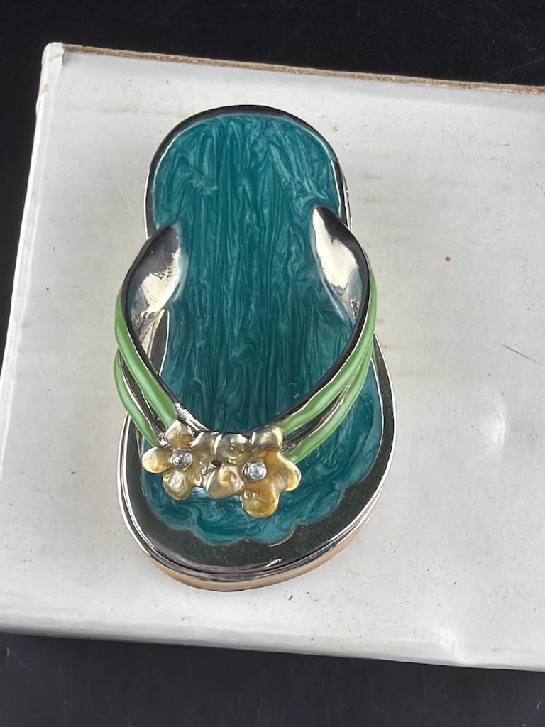 collectible enameled metal flip flop / sandal hinged keepsake trinket box from Monet: A charming, collectible enameled metal flip flop / sandal hinged keepsake trinket box from Monet. The design features a texturized teal/seafoam green enameled insole bordered by a polished silver-tone