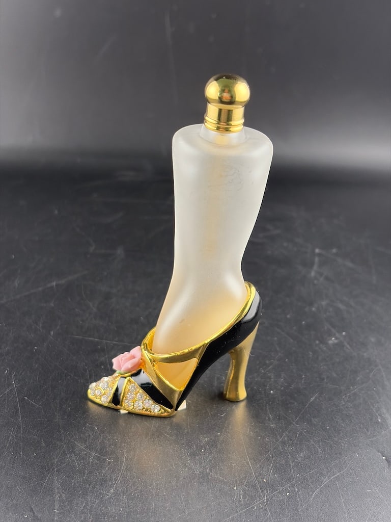 Vintage Frosted Glass Leg & Rhinestone High Heel Perfume Bottle: A vintage, figural novelty miniature perfume bottle designed in the shape of an elegant woman's leg wearing a stiletto high-heeled shoe. The leg portion is crafted from translucent satin frosted glass
