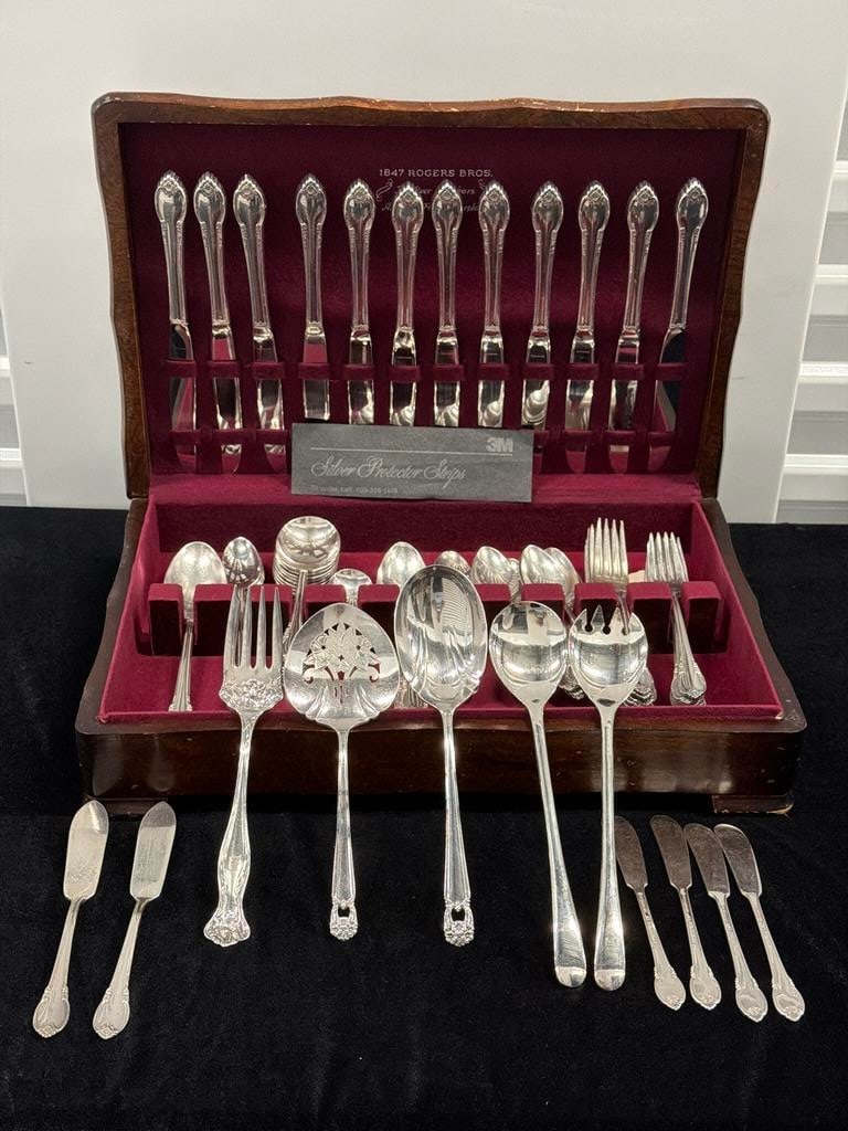 Vintage 1847 Rogers Bros. Silverplate Flatware & Serving Pieces in Fitted Wood Chest DC_241: Vintage collection of 1847 Rogers Bros. silverplate flatware housed in a fitted wooden storage chest with burgundy velvet-lined interior marked “1847 Rogers Bros. – For Over 100 Years – America�