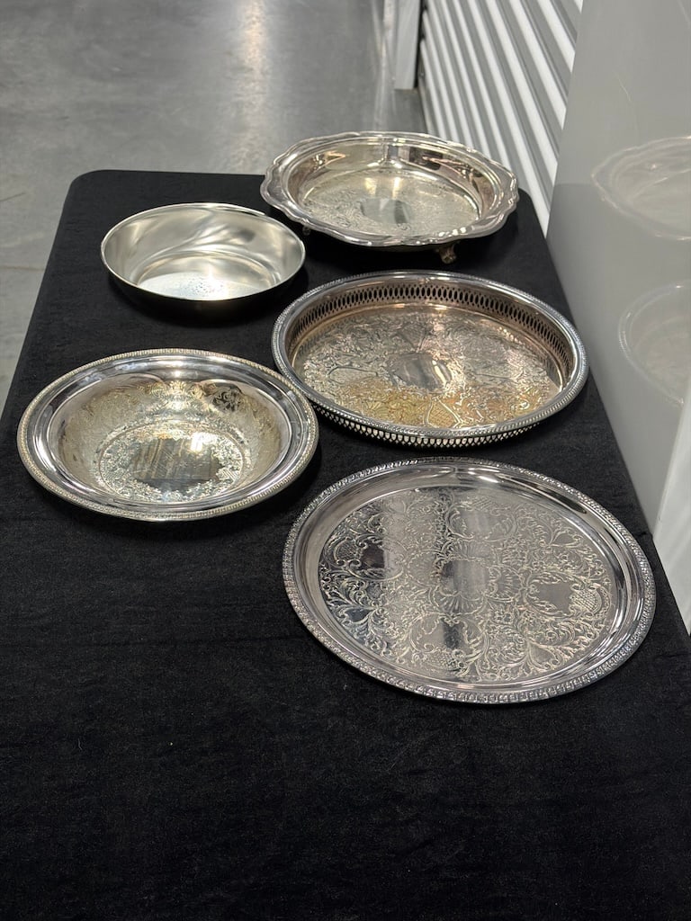 Collection of Ornate Silver-Plated Serving Trays and Dishes DC_243: Mixed lot of assorted silver-colored serving pieces, including oval and circular trays and shallow dishes, featuring engraved scrolling floral decoration, beaded rims, pierced gallery sides, and scall