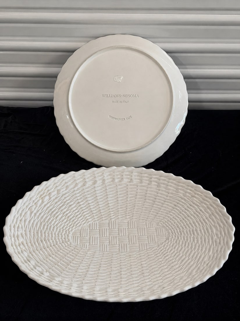 Elegant White Ceramic Serving Platter - Williams Sonoma: "Elegant White Ceramic Serving Platter - Williams SonomaThis oval-shaped serving platter is white, featuring a textured woven design and is marked 'Williams Sonoma Made in Italy' on the bottom."