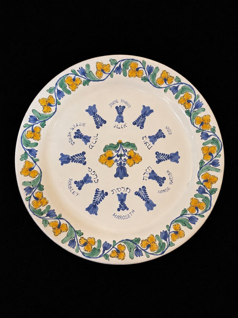 Vintage Passover Seder Plate with Colorful Floral Design: "Vintage Passover Seder Plate with Colorful Floral DesignThis decorative ceramic Seder plate features a vibrant floral border in yellow and blue, with labeled sections for traditional Passover foods."