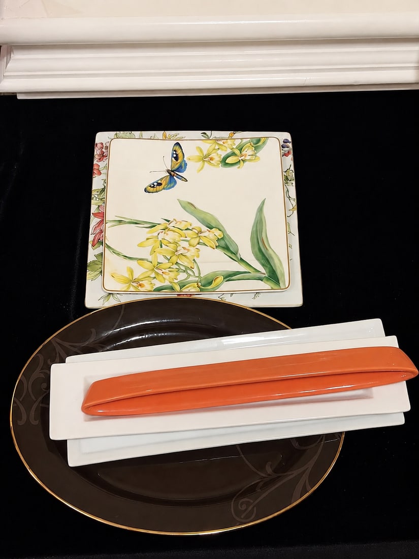 Mixed Designer Porcelain Servingware Lot: Mixed Designer Porcelain Servingware LotAssorted contemporary porcelain serving pieces including two square floral plates with chrysanthemum, orchid and butterfly decoration, a large chocolate-brown