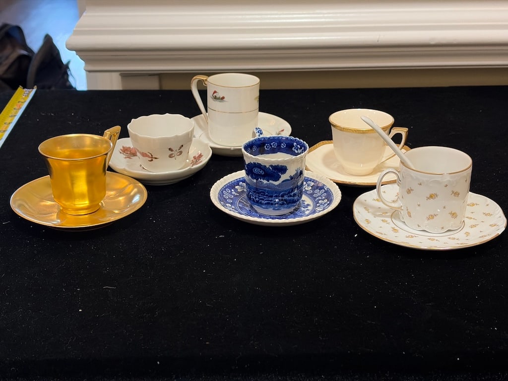 Assorted Vintage Porcelain Demitasse Cups & Saucers – German, Noritake & Thompson: "Assorted Vintage Porcelain Demitasse Cups & Saucers – German, Noritake & ThompsonAssorted collection of vintage porcelain demitasse cups and saucers featuring floral, blue-and-white, and richly