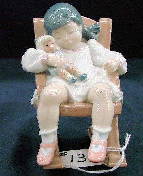 Lladro Figurine "Naptime" #5448, Depicts Little Gi: Lladro Figurine "Naptime" #5448, Depicts Little Girl with Doll Napping in Rocking Chair that Actually Rocks. Approx. 4.75" tall. Auction Estimate:$200-300.