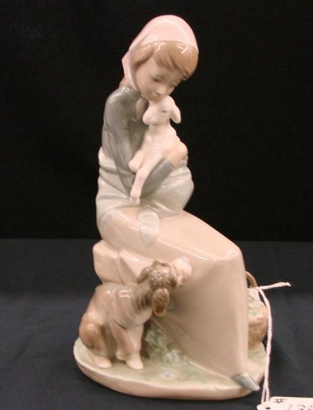 Lladro Figurine "Devotion" Retired Edition #1278,: Lladro Figurine "Devotion" Retired Edition #1278, Depicts Young Lady Holding a Lamb with Dog at her Feet. 9"H. Auction Estimate:$400-600.