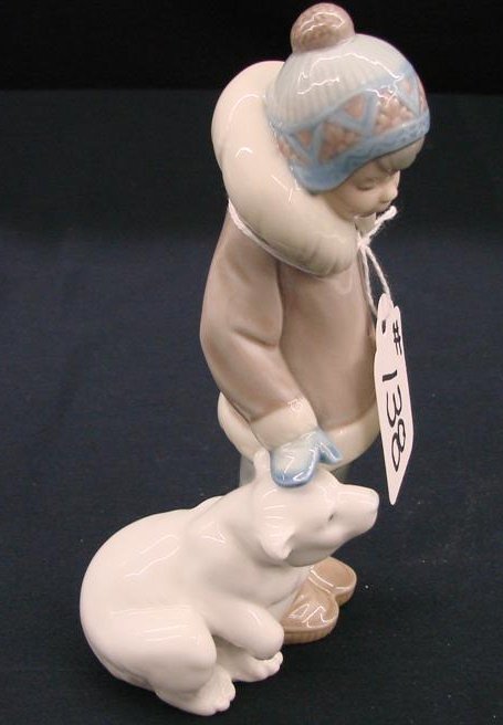 Lladro Figurine "Eskimo Boy with Pet" #5238. Depic: Lladro Figurine "Eskimo Boy with Bear" #5238. Depicts Boy with His Friend, a Cub Polar Bear. Approx 6". Auction Estimate:$100-200.