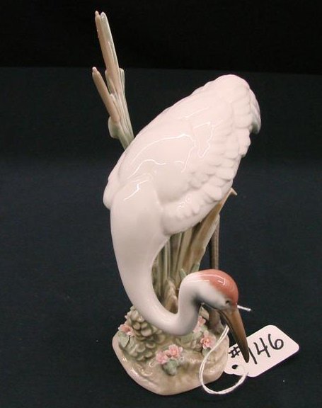 Lladro Figurine "Bowing Crane" #1613, Depicts Cran: Lladro Figurine "Bowing Crane" #1613, Depicts Crane at Bow. Issued 1989, Retired 1998. The Crane Figures are Very Difficult to Find. Approx 7 3/4"H. Auction Estimate:$400-800