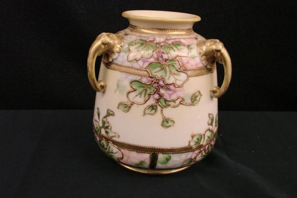 Antique Handpainted Nippon Vase with 3 Elephant He: Antique Handpainted Nippon Vase with 3 Elephant Head Handles and All Over Floral Decor with Raised String Enameling. 6" Ht. Auction Estimate:$150-250.
