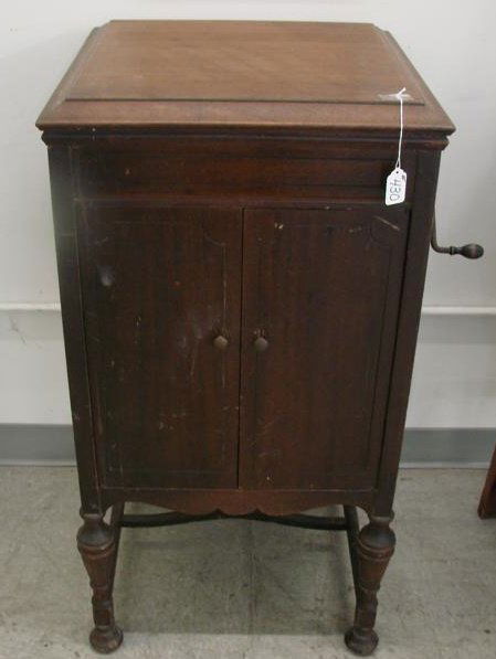 Antique Victor Wind-Up Victrola; Manufactured by T: Antique Victor Wind-Up Victrola; Manufactured by The Victor Talking Machine Company. This Mahogany Cased Floor Model is In Working Condition. Auction Estimate $200-400.