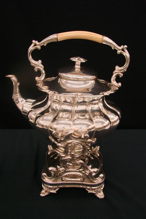 19th c. Silver Cradled Melon Shaped Coffee/ Teapot: 19th c. Silver Cradled Melon Shaped Coffee/ Teapot with Original Spirit Burner, Ivory Handle & Scrolled Border. Gorgeous! A Stunning Antique! Auction Estimate $600-800.