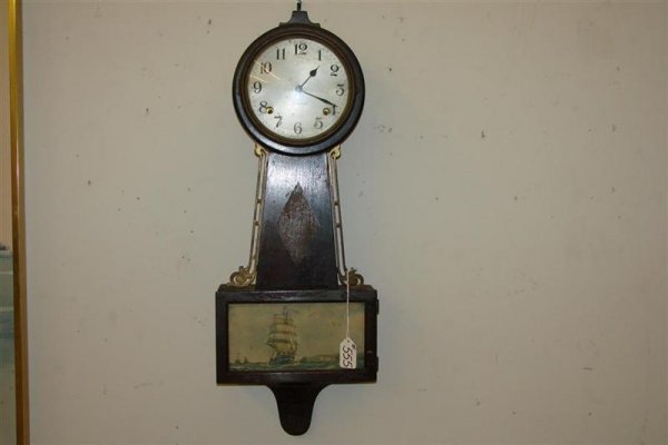 Sessions Banjo Clock with 3 Mast Ship on Door. Not: Sessions Banjo Clock with 3 Mast Ship on Door. Note: Missing Finial, Sold AS IS. Auction Estimate $50-100.