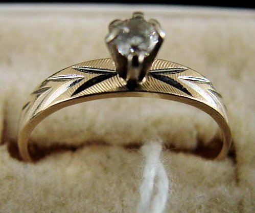 14K Yellow Gold Pear Shaped Diamond Ring: 14K Yellow Gold Diamond Ring with a Pear Shaped Diamond Solitaire Size 4.5, 1.5 Grams. Auction Estimate $100-200.