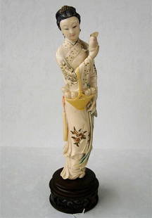 Antique Polychromed Ivory Figurine of a Lady: Antique Carved Ivory Figurine of Oriental Lady in Elaborate Dress with all-over Polychrome Decoration. Ht. 9.5 inches. Auction Estimate $400-600. THE LAW STATES THAT WE CANNOT SHIP IVORY OUT OF THE US