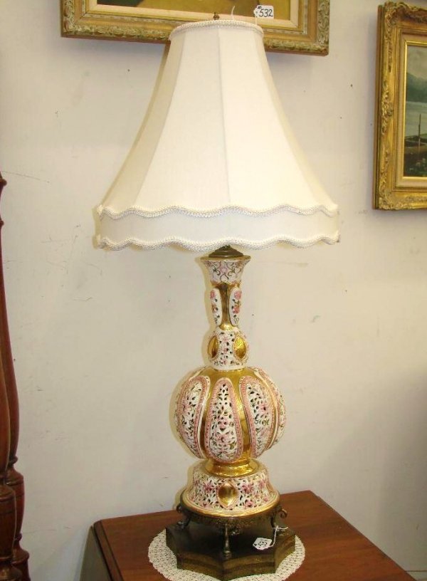 Capodimonte Porcelain Pierced-Decorated Lamp with : Capodimonte Porcelain Pierced-Decorated Lamp with Cloth Shade & Brass Base. 38" Ht. Auction Estimate: $100-200.