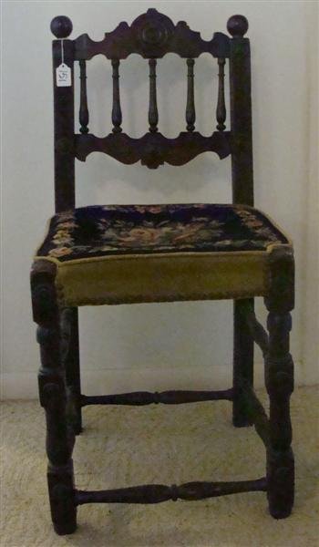 17 Century Jacobean Chair: 17th Century English Jacobean Hall Chair with Upholstered Needlepoint Seat with Spool Back and Flemish Scroll Top. Circa 1660. Auction Estimate: $400-600