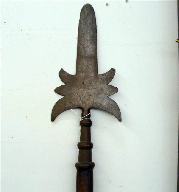 17c Bavarian Partisan Halberd: 17th Century Bavarian Partisan Halberd, Hammered Etched Blade with Octagonal Ferrule. Ferrule is Original. Pole in Good Condition. 73.5" Overall Length. Note: Slight Pitting. Auction Estimate: $400-60