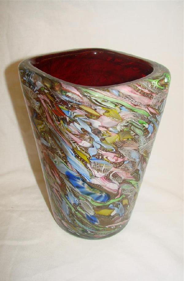 Fratelli Toso Murano Vase by Pollio Perelda: Art Moderne Toso Fratelli Co. Murano Glass Vase attributed to Pollio Perelda. Circa 1950s. 8" Ht. with a Diameter of 5" at Top. No Nicks, Chips or Cracks. Ground Pontil. Auction Estimate $1000-2000.