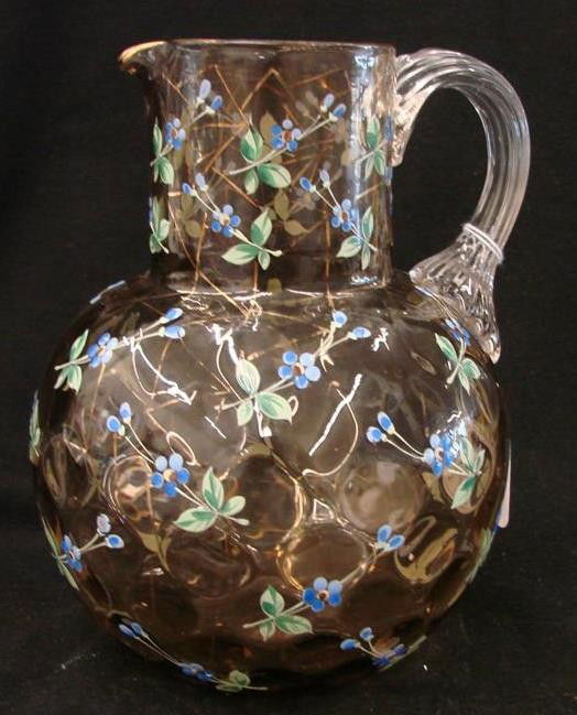 Unsigned Moser Art Glass Coin Dot Pitcher with All: Unsigned Moser Art Glass Coin Dot Pitcher with All-Over Enameled Flowers, Gold Decor, & Applied Clear Glass Handle. Auction Estimate: $200-400.