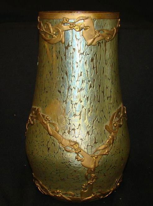 Unsigned Loetz Art Glass Vase with Brass Metal Wor: Unsigned Loetz Art Glass Vase with Brass Metal Work Around Vase. 9.75" Ht. Auction Estimate: $200-400.