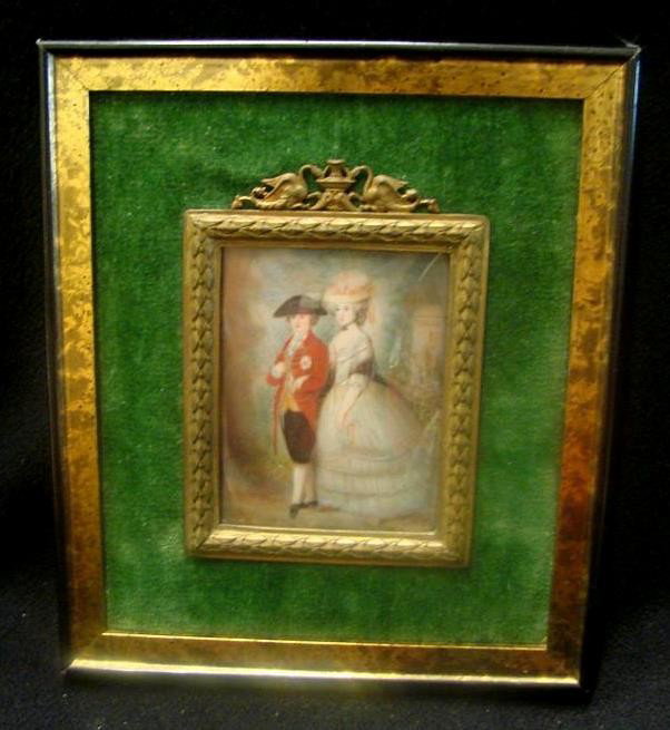 Antique Painting on Ivory Depicting a Military Gen: Antique Painting on Ivory Depicting a Military Gent in Red Coat and Black Hat standing beside Lady in Ballgown with Hat. Artist Signed Illegibly. Probably English School. Wooden & Brass Frame measures