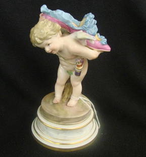 19th Century Meissen Figurine of a Cherub Carrying: 19th Century Meissen Figurine of a Cherub Carrying an over-sized Lady's Shoe Over His Back. 7" h. Auction Estimate: $400-600.