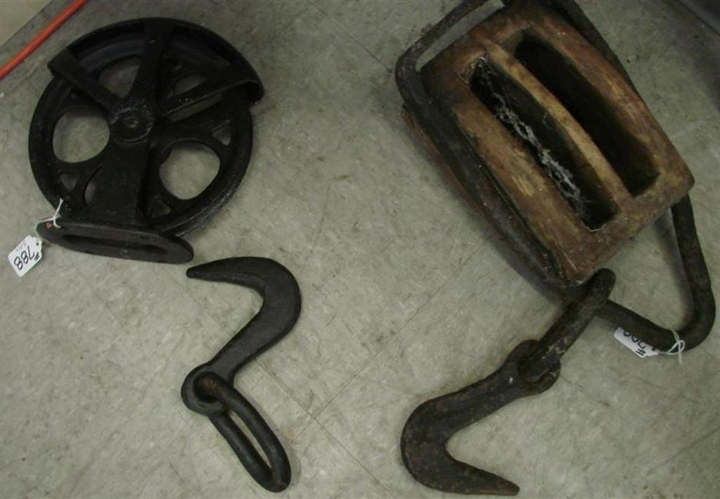3 Antique Primitive Tooel Items: Pulley & Eye Hook: 3 Antique Primitive Tool Items: Includes a Woodblock with Hook, a Pulley for a Well & an Eye Hook. Auction Estimate $50- 100.