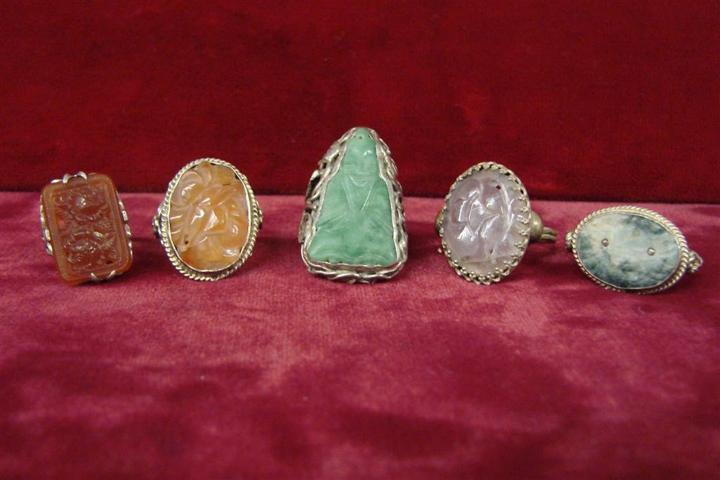 5 Sterling Silver Rings w/ Carved Stones incl Jade: Five Sterling Silver Rings with Carved Stones Including Jade, Carnelian & Quartz. 26.1 Grams. Auction Estimate $50-100.