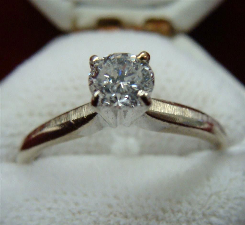 14K White Gold Diamond Solitaire Ring w 1/4 ct: 14K White Gold Diamond Solitaire Ring with a Beautiful 1/4 ct Diamond. Size 5; 1.8 Grams. Auction Estimate $200-300.