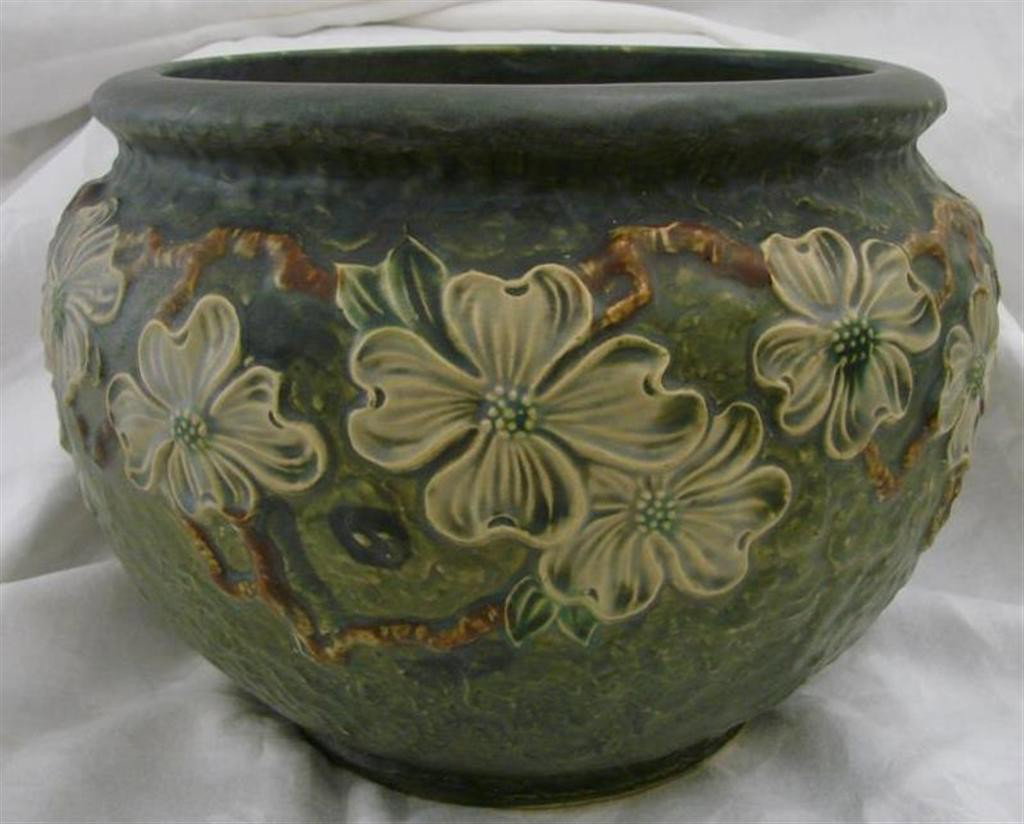 Roseville Pottery Dogwood I (Textured) Jardiniere: Lg Roseville Dogwood I Art Pottery Jardiniere. Lovely e&le of Dogwood I Pattern, aka Te&tured Dogwood (circa 1926), on a Green Background. 12.5"dia x 9.25"h. Note: Has Crows Foot On Base that does