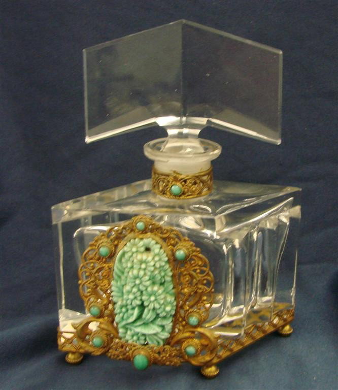 Antique Czechoslovakian Cut Crystal Perfume Bottle: Antique Signed Czechoslovakian Cut Crystal Perfume Bottle. This Art Deco Czech Perfume Bottle is designed in an Art Deco Geometric Shape with Gilded Metal Base. The Front is Decorated with Turquoise C