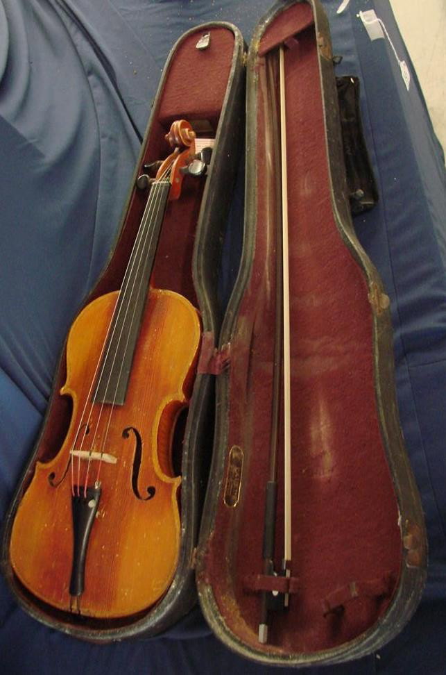 Antique Violin w Bow &Case; Labeled Strativarius: Antique Violin with Bow and Case; Paper Label on Interior says Antonio Strativarius. 24" L x 8.5" across the widest point Auction Estimate $200- 400.