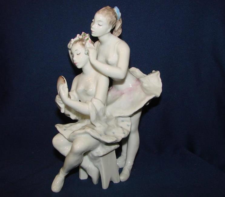 Rosenthal Porcelain Figurine of Two Ballerinas w: Signed Rosenthal Porcelain Figurine of Two Ballerinas; One is Fixing the Others Hair while she looks in a Hand Mirror. 7" h. Auction Estimate: $150-250.