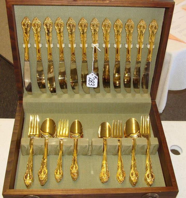 Gold Plated Flatware Dinner Service for Twelv: Gold Plated Flatware Dinner Service for Twelve in Original Wooden Case with Serving Pieces. Pierced Rose Pattern by Estia Corp, Park Ave, NJ. 66pcs Total. Auction Estimate: $100-200.
