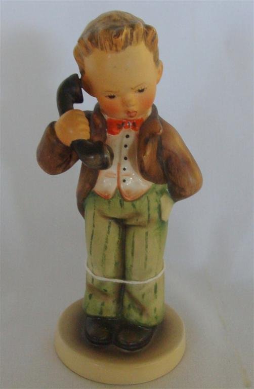 Hummel Figurine: Hello #124/0; TM 3: Hummel Figurine: Hello #124/0; TM 3. Book Value $250. Auction Estimate $80-100.