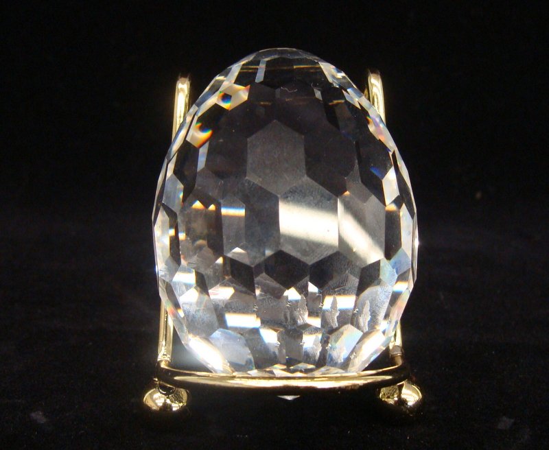 Retired Swarovski 1992 Egg Paperweight # 7458 063: Swarovski Crystal Figurine: Faceted Egg Paperweight # 7458 063. Theme Group: Decorative Items for the Desk; Designer: Max Schreck; Out of Production / Retired. Auction Estimate $100-200.