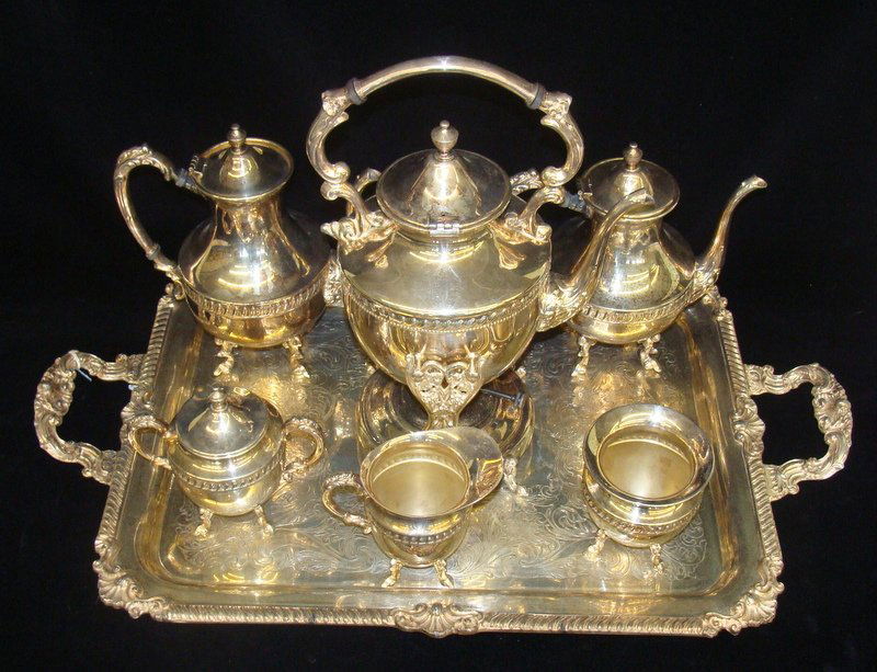 8pc Antique Silver Tea & Coffee Set w/ Tray: 8pc Silver Tea Set: Includes Tray, Creamer, Sugar, Waste Bowl & 3 Sizes of Coffee & Tea Pots with Burner and Holder. Auction Estimate $600-800.
